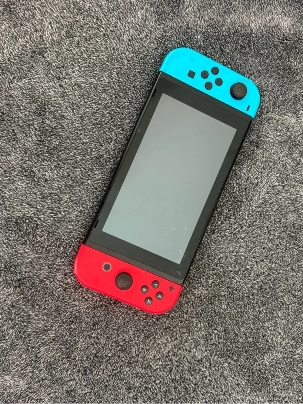 Nintendo Switch with Red & Blue Joy-Con Controllers + hand held controller